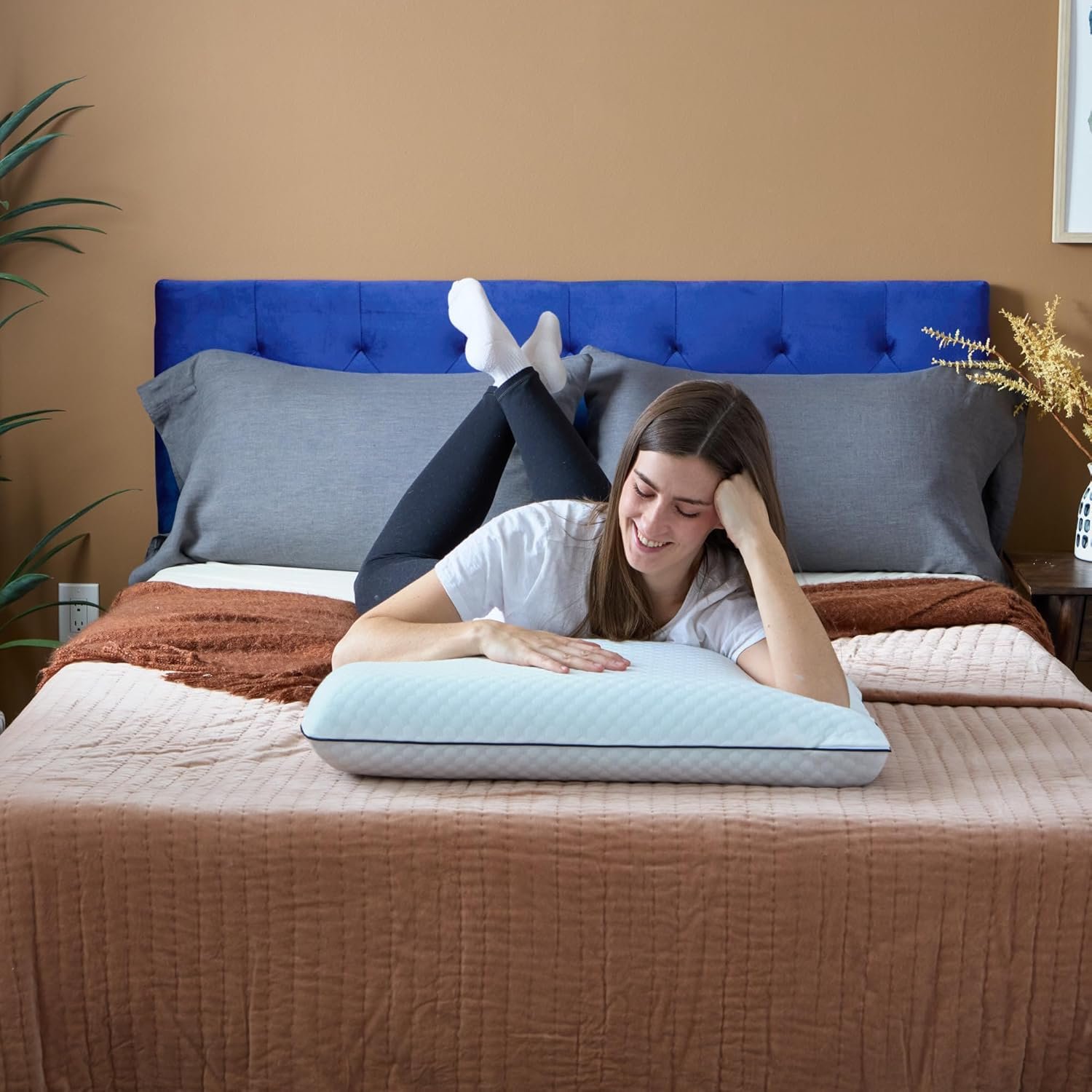 Side sleeper resting on the Weekender cooling gel memory foam pillow showing neck and shoulder alignment